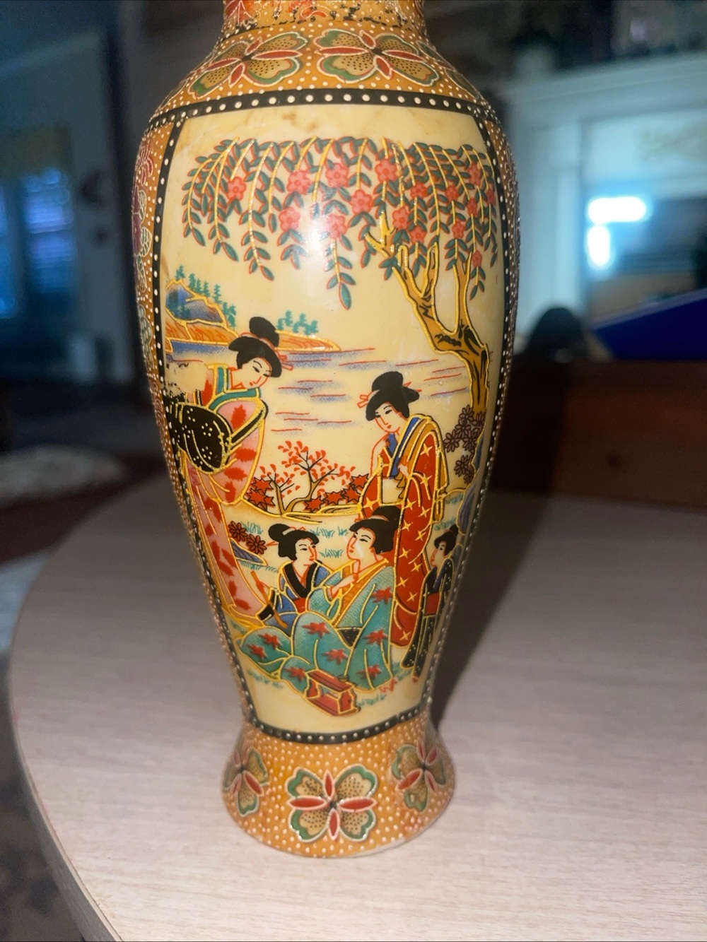 Porcelain vase with hand-painted geisha garden scene in Satsuma style